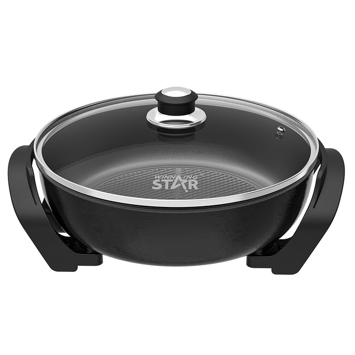 Black electric skillet with a glass lid and black handles, featuring the 'STAR' brand logo on the bottom of the pan, shown against a plain white background.